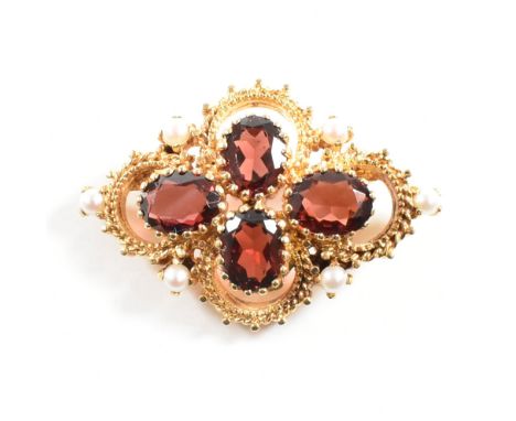 Hallmarked 9ct gold garnet and pearl brooch pin. The brooch set with three oval cut garnet having accent pearls with roller c