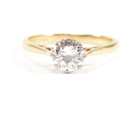 A hallmarked 18ct gold and diamond solitaire ring. The ring hallmarked Birmingham. Estimated diamond weight 0.80ct&nbsp; Weig