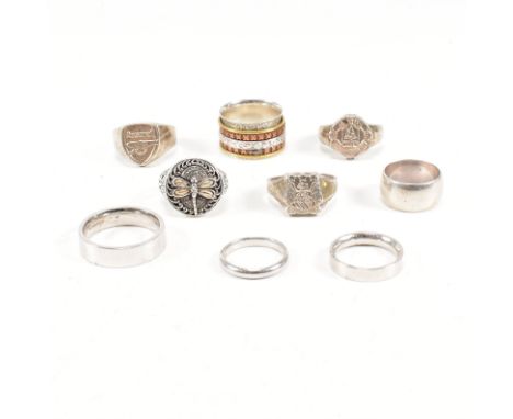 A collection of 925 silver rings.The rings to include pierced, puzzle, dragonfly 18ct gold overlay, Manchester United signet 