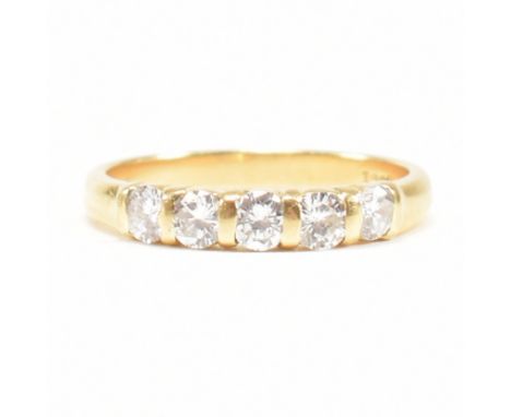 An 18ct gold and diamond five stone ring. Estimated total diamond weight 0.60ct. Size M.5. Weight 2.6g.  All weights, measure