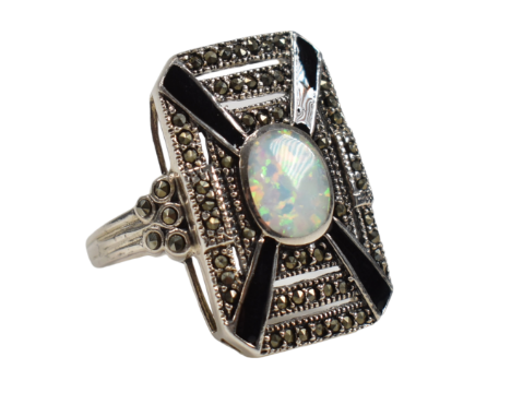 A contemporary 925 silver marcasite and synthetic opal panel dress ring. Weight approx&nbsp;7.9g. Size approx O.&nbsp;All wei