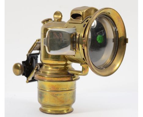 A rare Lucas Garda carbide brass car lamp with side rear red lens