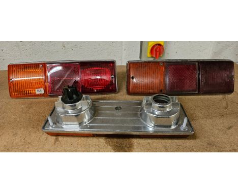 Two Lucas L782 RH rear light units, NOS, and a used example. As fitted to Lotus 7 and Aston Martin DBS. 