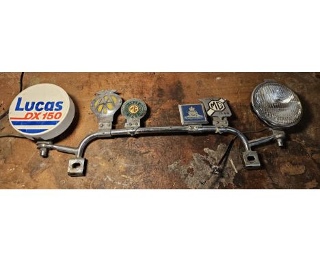 A chrome lamp/bar bar with a pair of Lucas DX150 lamps and 4 badges 