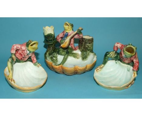 A Continental majolica pipe stand, decorated a frog, 12.5 cm high, and two similar dishes (restored) (3)