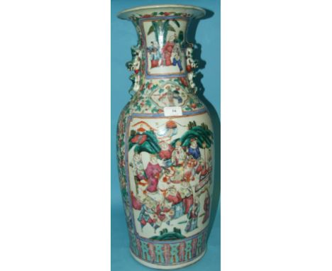 A large Chinese famille rose vase, with Dogs of Fo handles, decorated panels of figures on a ground with peonies, birds and o