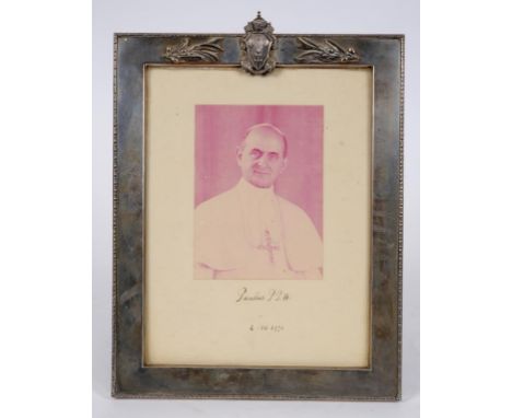 A signed photograph of Pope Paul VI, dated 4-XII-1970 and with papal seal, in an Italian silver coloured metal strut photogra