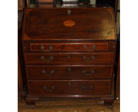 A late 18th century inlaid mahogany bureau, the fall front revealing a fitted interior, above four graduated long drawers, on