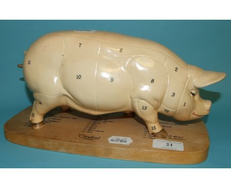 A Goebel pig, with a plaque showing butcher cuts, 13 cm high (2)