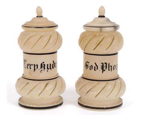 A pair of alabaster albarello jars and covers, inscribed Terp.hudr and Sod.Phos (finials glued, slightly chipped), 25 cm high
