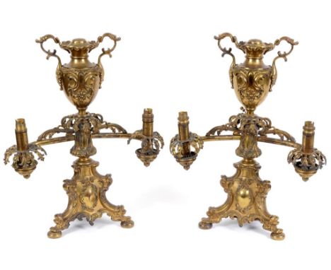 A pair of Victorian I & C Ratcliff, Birmingham Patent colza brass two light table lamps, with rococo style decoration (adapte