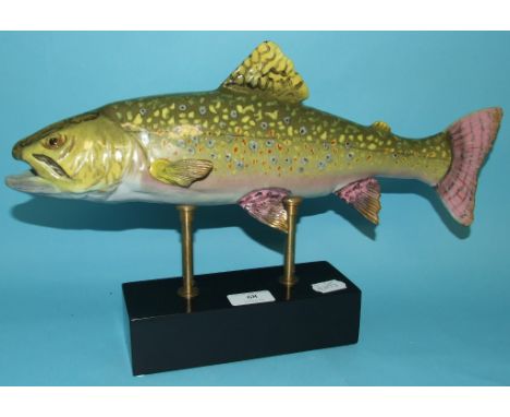 A ceramic trout, on a base, 26 cm high