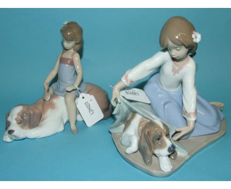 A Lladro figure, Dog's Best Friend, 3688, 15 cm high, and three others, Contented Companion, 6229, 14 cm high, A Litter of Lo