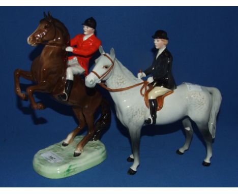 A Beswick Huntswoman, grey, 1730 (leg glued, hat chipped), and Beswick Huntsman, second version, 868 (ear chipped), both glos