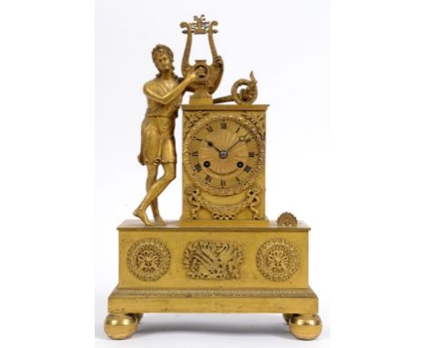 A 19th century French mantel clock, the 7 cm diameter dial with Roman numerals, fitted an eight day movement, in an Empire st