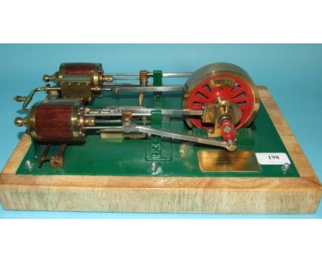 A scale model of a twin cylinder horizontal steam engine, with coopered cylinders, 10 cm diameter flywheel and other traditio