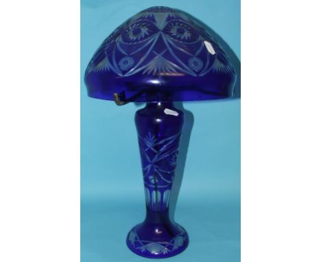 A blue and clear cut glass mushroom table lamp, 55 cm high, and a similar pair of vases, 27.5 cm (3)