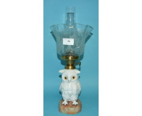 An oil lamp base, in the form of an owl, with an etched glass shade, 37 cm high