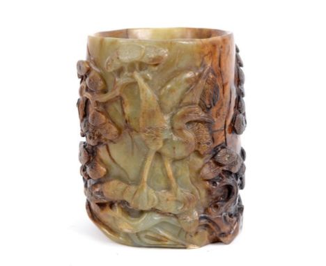 A Chinese jade brush pot, carved birds amongst foliage (a.f.), 14 cm high  See illustration Condition report Report by RB

Pr