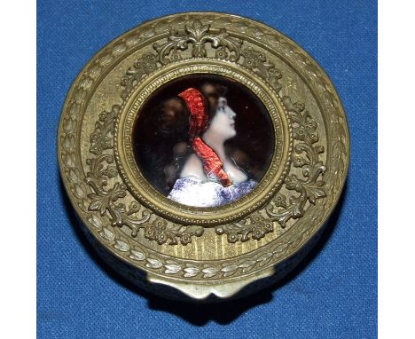 A 19th century gilt metal box, the cover inset an enamel bust portrait of a lady in profile, 7 cm diameter 