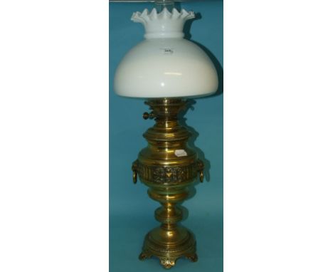 A 19th century brass oil lamp, with a white and clear glass shade, 64 cm high (overall)