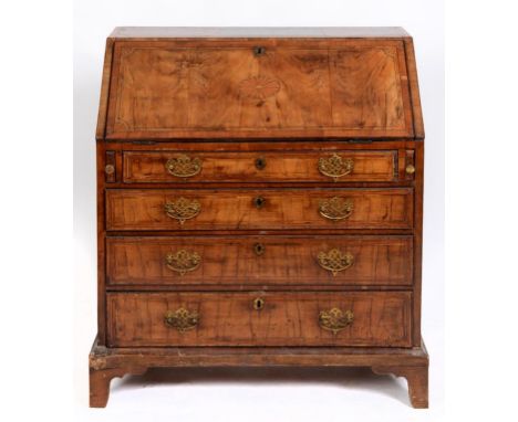 An 18th century inlaid walnut bureau, the fall front above four graduated long drawers, on bracket feet, 94 cm wide  See illu