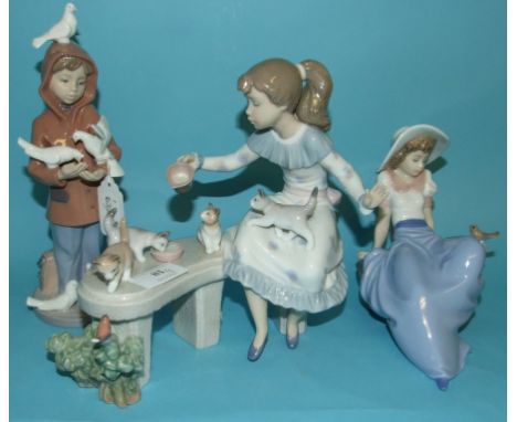 A Lladro group, Meal Time, 6106, 20 cm high, another, Little Friends, 6129, 23.5 cm high, and a Nao figure, 1042, 15 cm high,