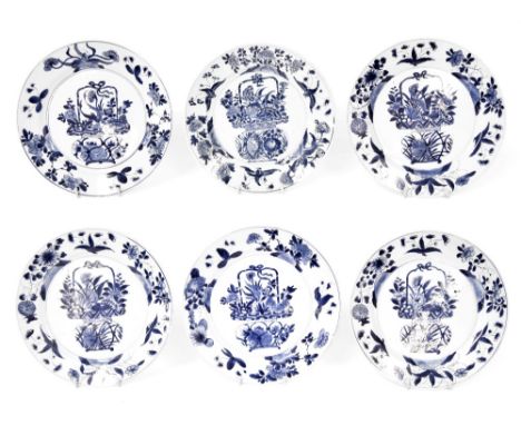 Set of six Chinese blue and white porcelain plates, decorated with vases and displays of flowers within foliate borders, bear