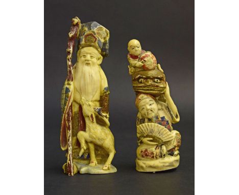 Japanese ivory okimono of a gentleman in full coloured dress holding a staff and a  deer at his side, 6" high; together with 