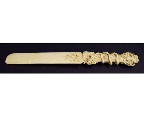 Fine 19th century ivory paper knife, finely carved to the handle with fruiting vines, 12" long