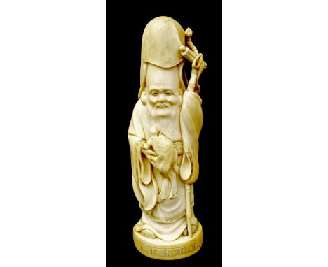 Japanese ivory okimono of a standing sage holding a tortoise, signature mark to base, Meiji period, 7.75" high