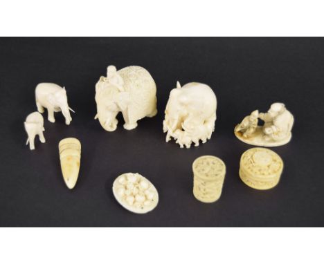 Selection of mixed antique ivory to include four various carvings of elephants, two Canton circular boxes, okimono, oval carv
