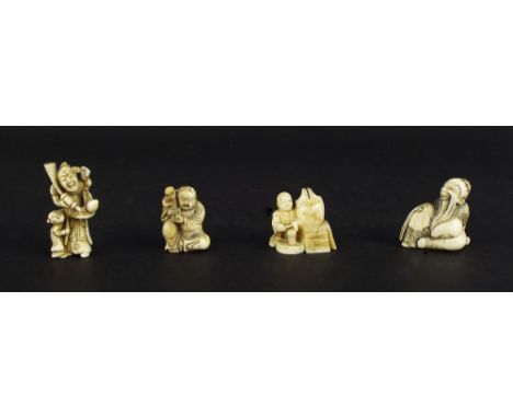 Four Japanese ivory netsuke, each modelled with figures in various pursuits, the largest 2" high (4)