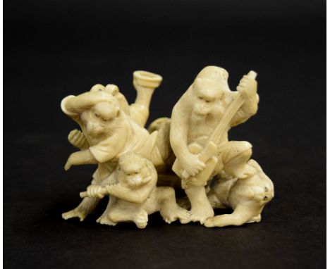 Japanese ivory okimono group modelled with seven monkeys playing musical instruments, Meiji period,  2" high