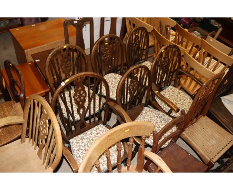 A set of six stick and wheel back dining chairs, four standards, two elbows