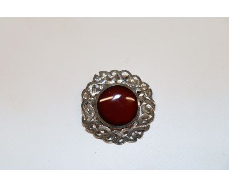 A Sterling silver Celtic knot brooch with Carnelian centre stone 