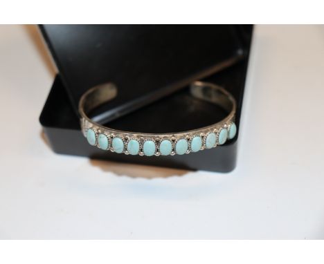 A Navajo Sterling silver and turquoise torque bangle, approx. 24gms 