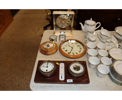 A clock and barometer set; a Sestrel alarm clock; a circular barometer and three other clocks 