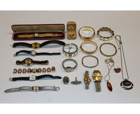 A box containing various wrist watches, a 9ct gold bangle with metal core, a 9ct rolled gold bangle, dress rings etc.