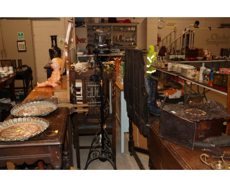 A wrought metal and copper adjustable standard lamp and a pendant light fitting