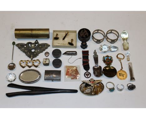 A pair of glove stretchers, various badges, cuff-links, stamps, napkin rings, dress rings etc.