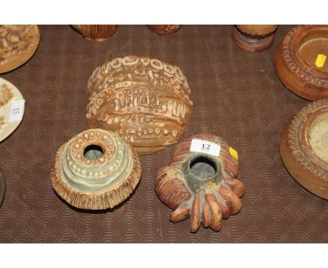 A Bernard Rooke pottery wall mounting posy holder, a Bernard Rooke squat vase and a similar 