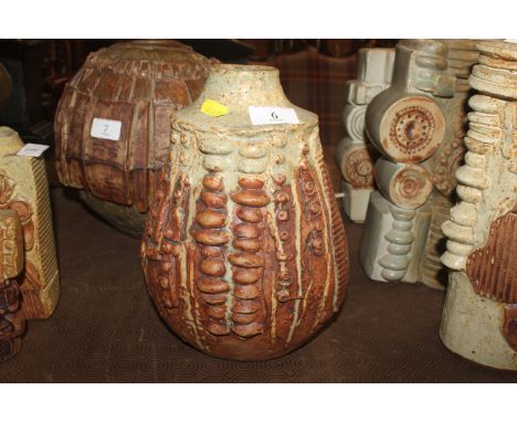 A Bernard Rooke pottery baluster vase decorated leaves and fruit 