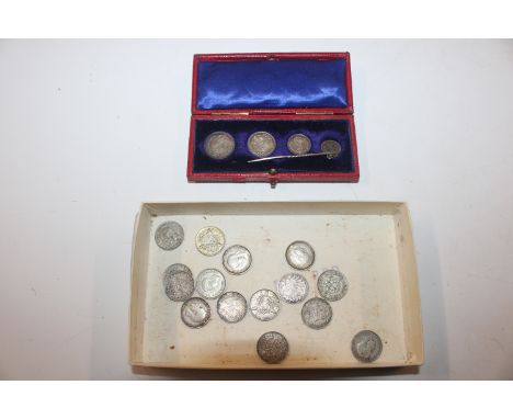 A box of silver and other threepences; and a set of Maundy Money; the small coin mounted to a stick pin 