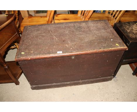 An antique pine trunk with rope work carrying handles 