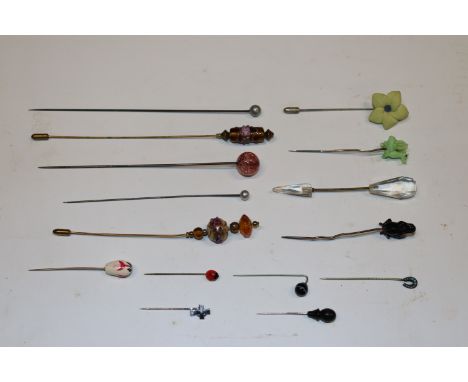 A collection of stick pins and hat pins 