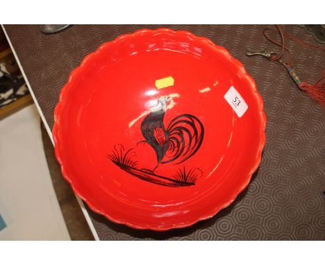 A Henriot Quimper red glazed bowl with cockerel decoration