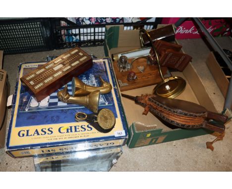 A glass chess set; an inlaid cribbage board; decorative brassware; a bevelled frameless wall mirror; a pair of bellows; a des