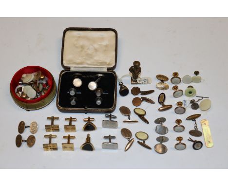 A collection of cuff-links and dress studs including a pair of yellow metal cufflinks (not hallmarked)