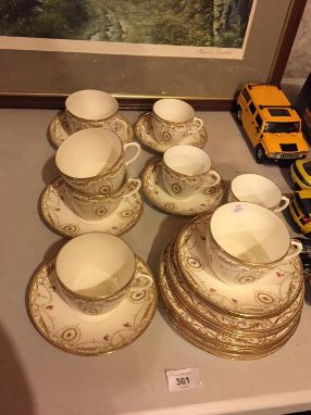 Weimer porcelain set of five cabinet demi cups and saucers.